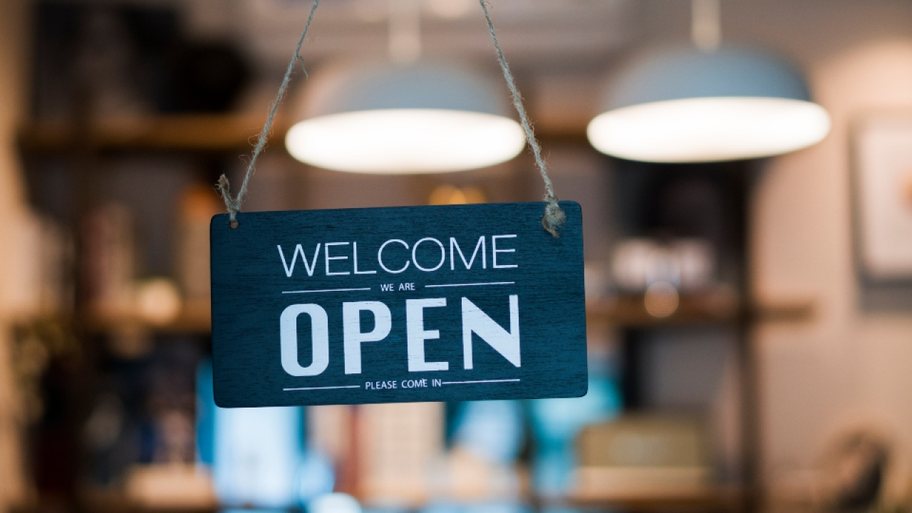 Store open sign hanging on the window